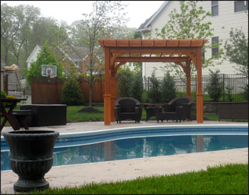 10 X 10 Cedar Deluxe 4 Beam Pergola shown with 2 Coats of Cedar Stain/Sealer and 8" Top Runner Spacing.