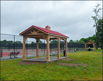  10 x 20 Cedar Gable Ramada shown with Open Gable, No Deck, 7 x 7  Laminated  Posts, 16" Post Trim, Cupola, 6/12 Roof Pitch, Dark Red Metal Roof and Stainless Steel Hardware.