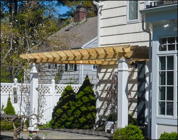 12 x 18 Treated Pine Wall Mount Solace Pergola shown with 8x8 posts and 16" top runner spacing. 