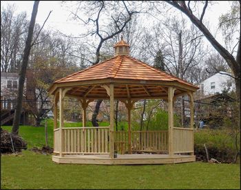 14 Economy Treated Pine Octagon Gazebo shown with  Cupola, No Top Rails, Treated Pine Deck, Cedar Shake Shingles, and Straight Fascia. 