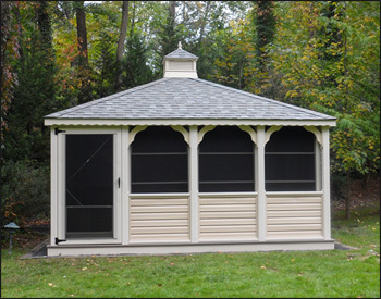  16 x 16 Vinyl Rectangular Gazebo shown with Almond Vinyl, Gray Composite Deck, Custom Solid bottom Rails, Standard braces, No Top Railing, Vinyl Finished Ceiling, 4 Track Window System with screens, Old English Pewter Asphalt Shingles, Offset Door, Hidden Wiring w/ 1 Receptacle & Switch.