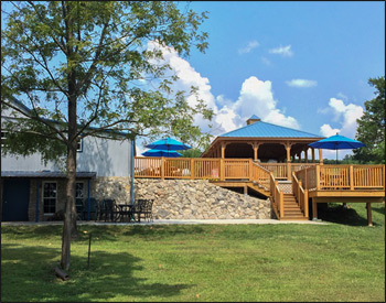   18 x 30 Treated Pine Rectangular Gazebo shown with Cupola, Blue Metal Roof, and Clear Stain/Sealer.