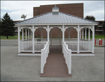 20 x 20 Vinyl Rectangular Gazebo  shown with Mahogany Composite Deck, Handicap Ramp with ADA metal handrails  approx 10-12 long , and Black Metal Exposed Fastener Roof