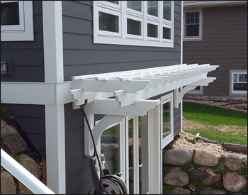 3 x 20 Treated Pine Eyebrow Breeze Pergola shown with White paint, galvanized hardware, 16" Main Runner Spacing, 12" Top Runner Spacing. 