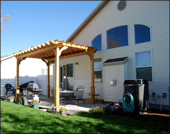 8 x 16 Treated Pine 2 Beam Pergola Shown with 2 Coats Cedar Tone Stain/Sealer, 12" Top Runner Spacing, 36" High Post Trim, Lattice Top, and 10 foot posts 