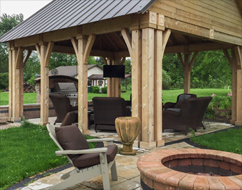 Custom 18 x 22 Cedar Gable Pavilion shown with closed gable, no deck, 8/12 roof pitch, 16" post trim, 8x8 Cedar wrapped posts, custom post height (10) Metal roof supplied by customer, and electrical package. 